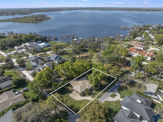 bird's eye view with a residential view and a water view