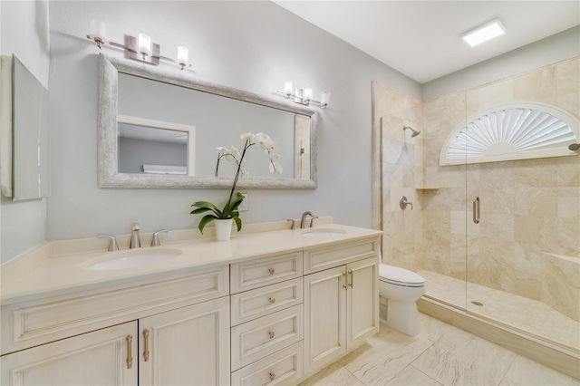 bathroom featuring a sink, toilet, a stall shower, and double vanity