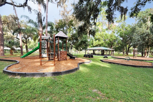 communal playground with a gazebo and a lawn