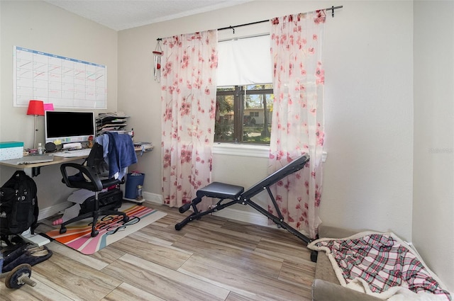 office with wood finished floors and baseboards