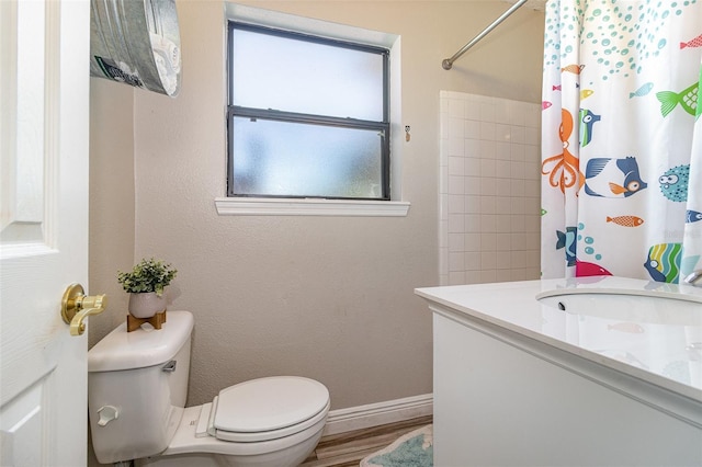 bathroom featuring a shower with curtain, baseboards, toilet, and wood finished floors