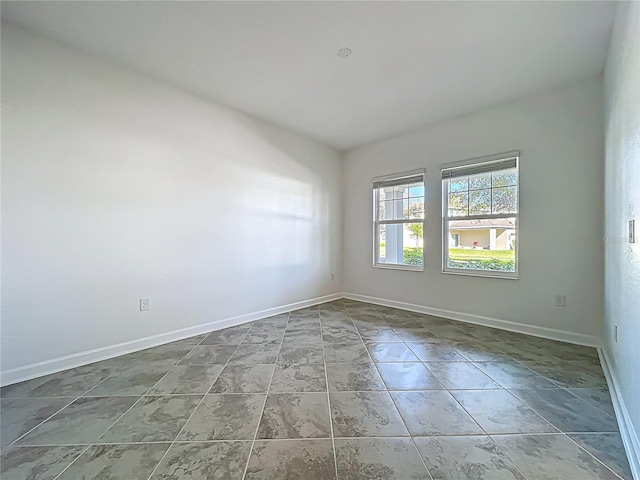 empty room with baseboards