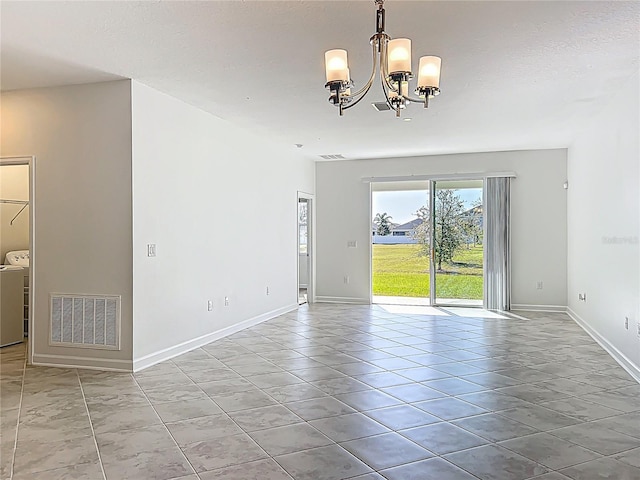 tiled spare room featuring a notable chandelier, visible vents, a textured ceiling, and baseboards