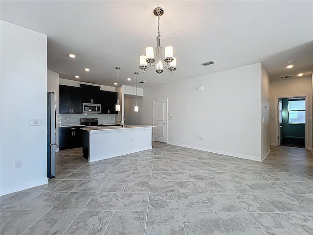 kitchen featuring visible vents, a chandelier, open floor plan, light countertops, and appliances with stainless steel finishes