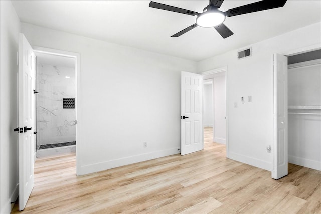 unfurnished bedroom with light wood-type flooring, visible vents, baseboards, and a closet