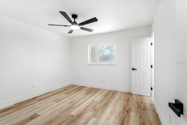 unfurnished bedroom with baseboards, light wood-style flooring, and a ceiling fan