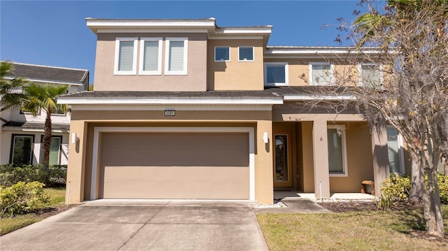 multi unit property with stucco siding, an attached garage, and concrete driveway