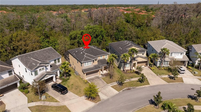 bird's eye view featuring a residential view and a view of trees