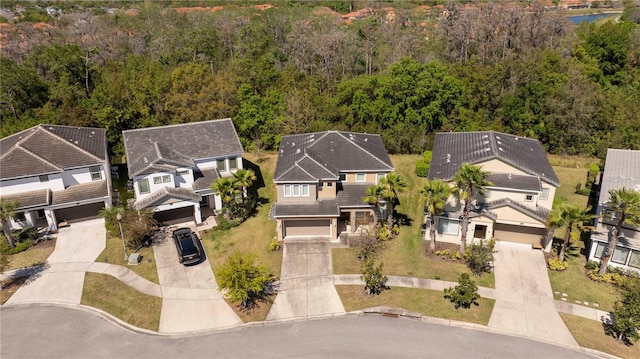 birds eye view of property with a residential view