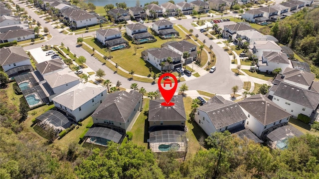 birds eye view of property with a residential view