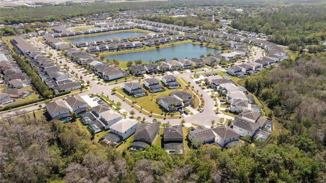 bird's eye view with a residential view and a water view