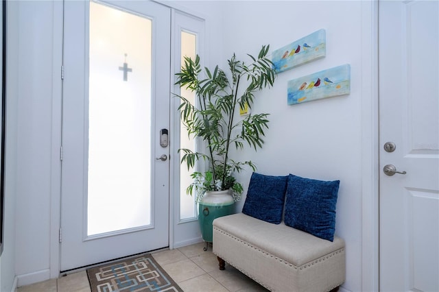 entryway with light tile patterned flooring