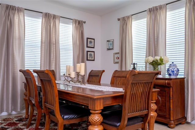dining area featuring light tile patterned floors