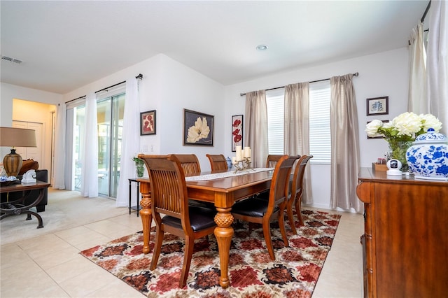 dining room with light tile patterned flooring and visible vents