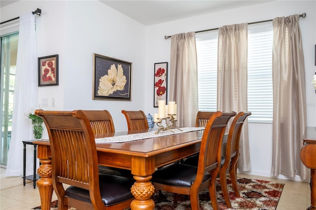 dining area with light tile patterned floors