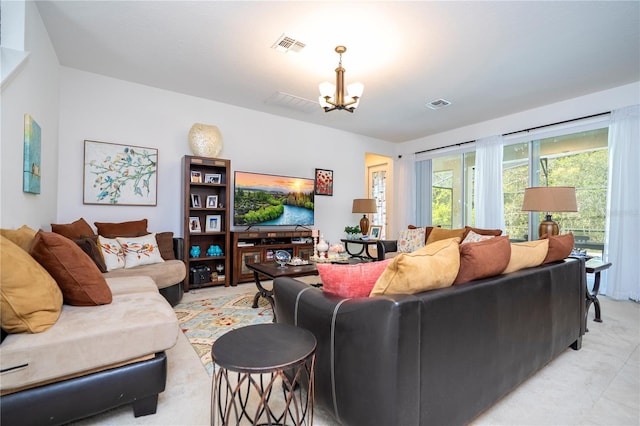 living room with an inviting chandelier and visible vents