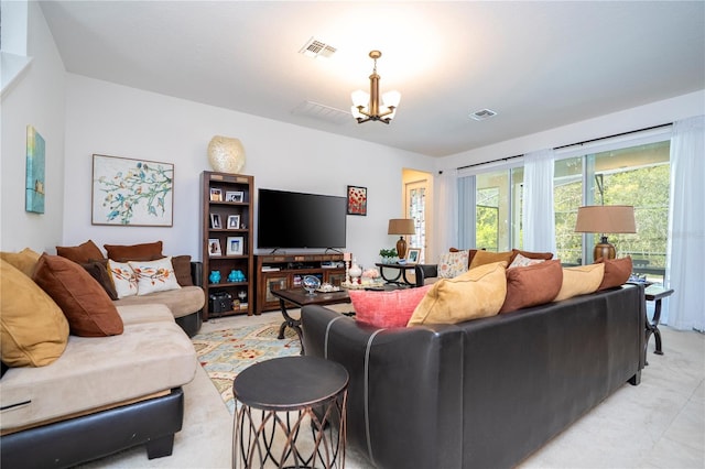 living room featuring a notable chandelier and visible vents