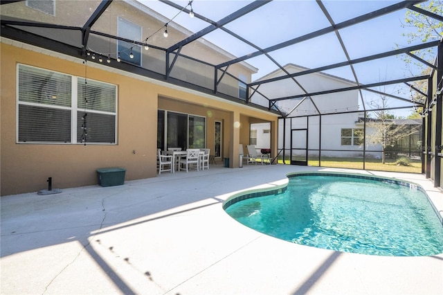 outdoor pool with outdoor dining area, a patio, and a lanai