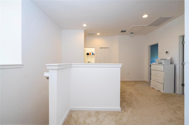 hallway featuring recessed lighting, visible vents, light carpet, and attic access