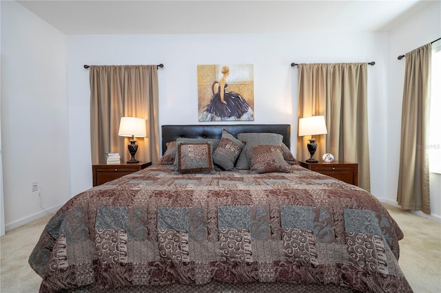 bedroom with carpet flooring and baseboards