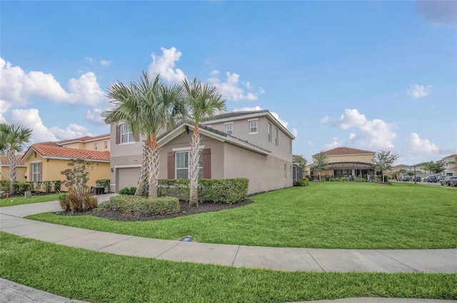 exterior space with stucco siding, an attached garage, concrete driveway, and a front yard