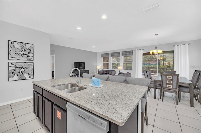 kitchen featuring visible vents, a sink, light tile patterned flooring, dishwasher, and a chandelier