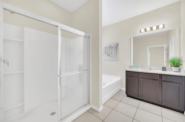 full bath with a bath, tile patterned flooring, a stall shower, and vanity