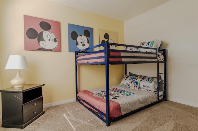 bedroom featuring baseboards and carpet floors