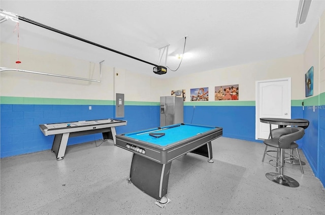 game room with electric panel, billiards, concrete block wall, and speckled floor