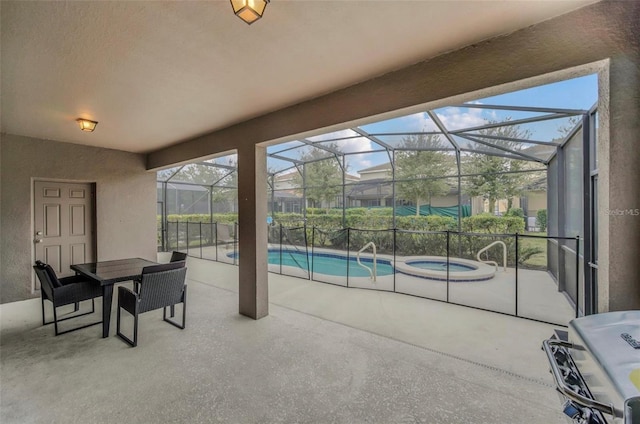 view of patio featuring a lanai and a pool with connected hot tub