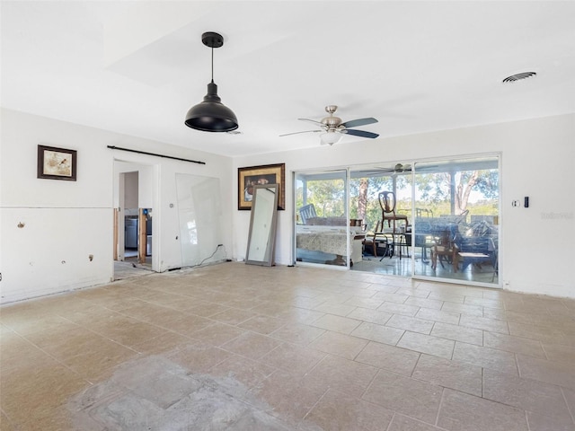 interior space featuring a ceiling fan and visible vents