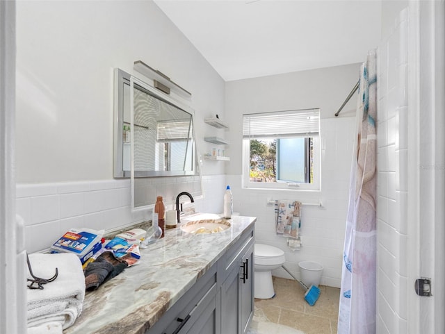 bathroom featuring vanity, tile walls, toilet, and a shower with curtain