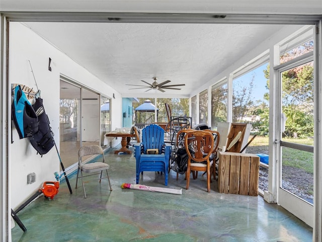 sunroom with a ceiling fan