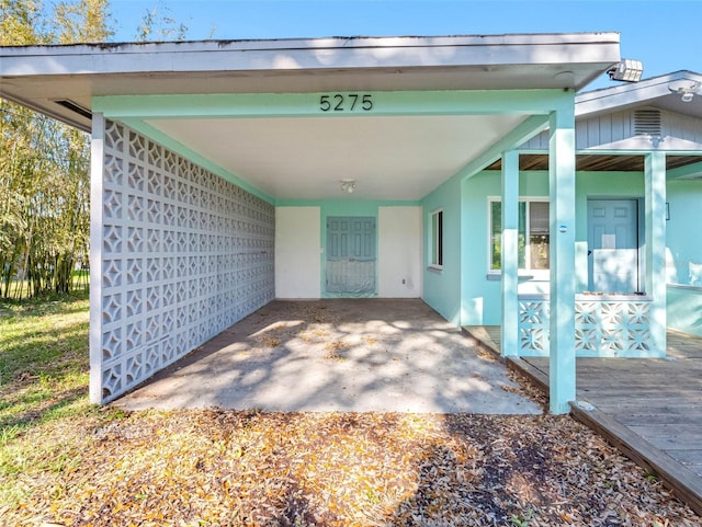 exterior space with an attached carport