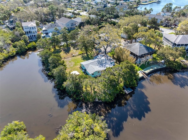 birds eye view of property featuring a water view and a residential view