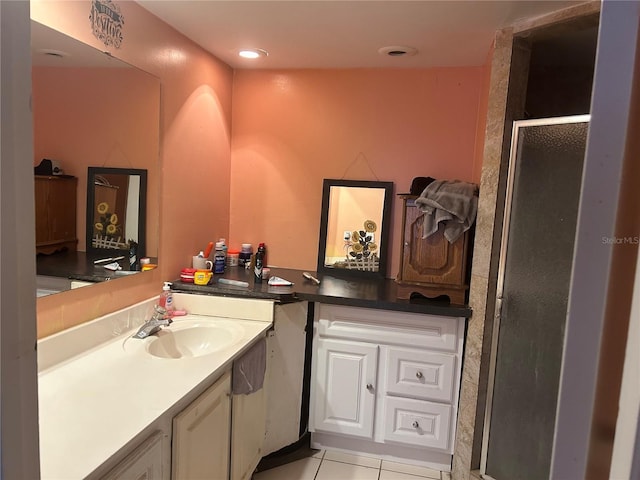 bathroom featuring tile patterned floors, recessed lighting, a stall shower, and vanity