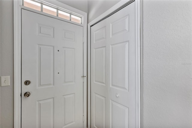 entryway with a textured wall