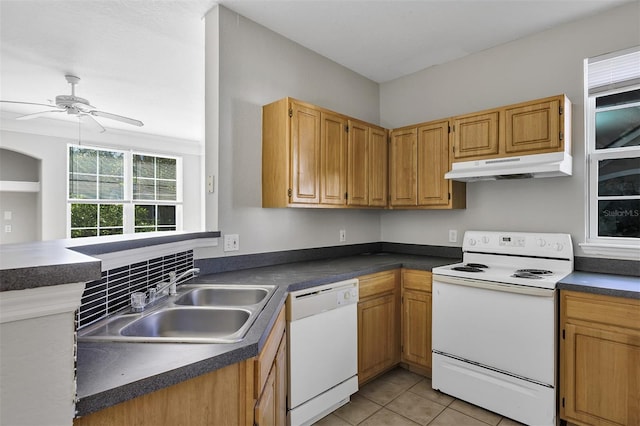 kitchen featuring under cabinet range hood, a sink, dark countertops, white appliances, and ceiling fan