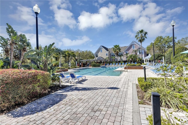 community pool with a patio area