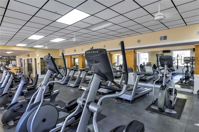 gym with visible vents and a paneled ceiling