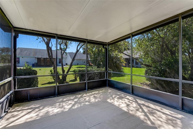 unfurnished sunroom featuring a residential view