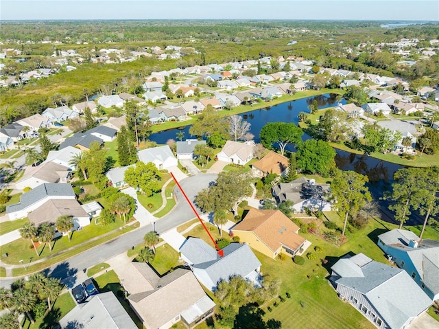 aerial view featuring a residential view and a water view