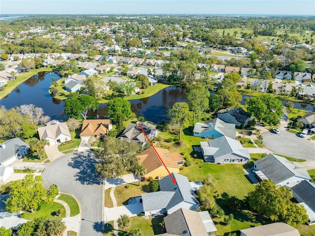 birds eye view of property featuring a residential view and a water view