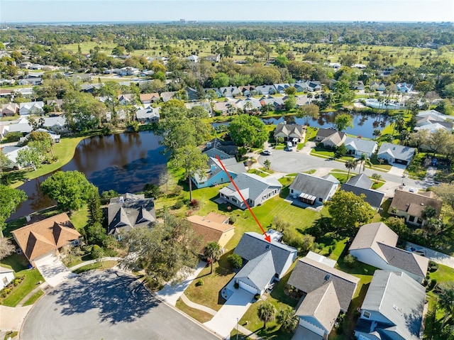 aerial view featuring a residential view and a water view