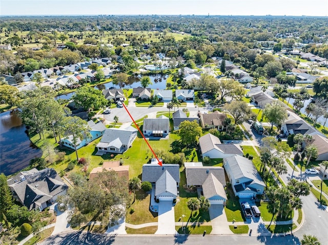 aerial view with a residential view and a water view