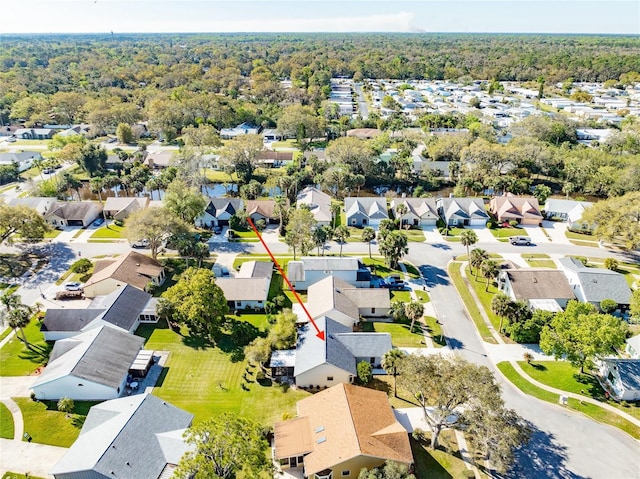 bird's eye view with a residential view and a wooded view