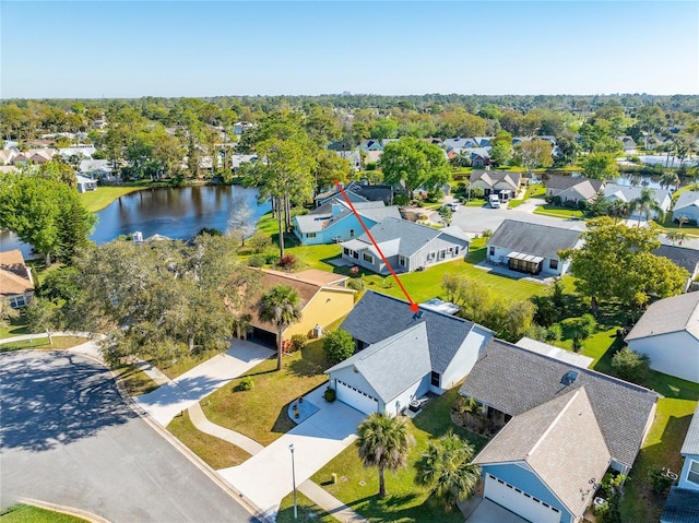 bird's eye view featuring a residential view and a water view