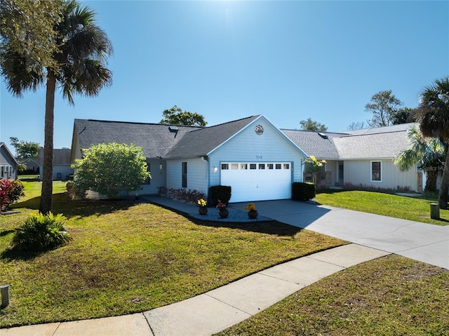 ranch-style house with concrete driveway, an attached garage, and a front lawn