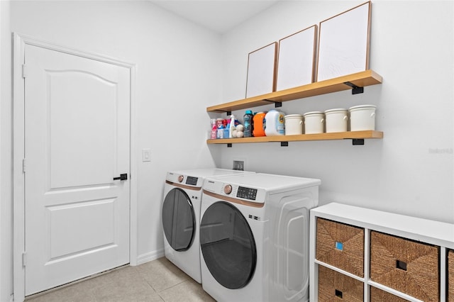 laundry room featuring light tile patterned floors, baseboards, independent washer and dryer, and laundry area