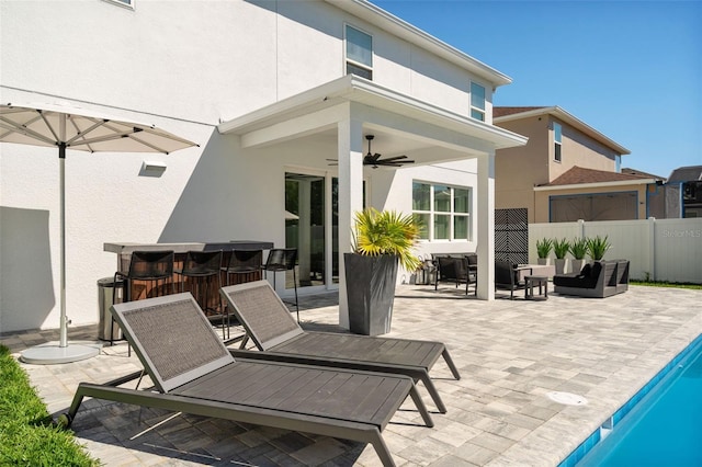 view of patio / terrace featuring a fenced in pool, an outdoor living space, a ceiling fan, and fence